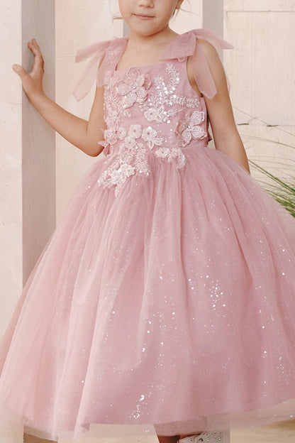 On this dusty rose flower girl dress, 3D bodice flowers are visible.