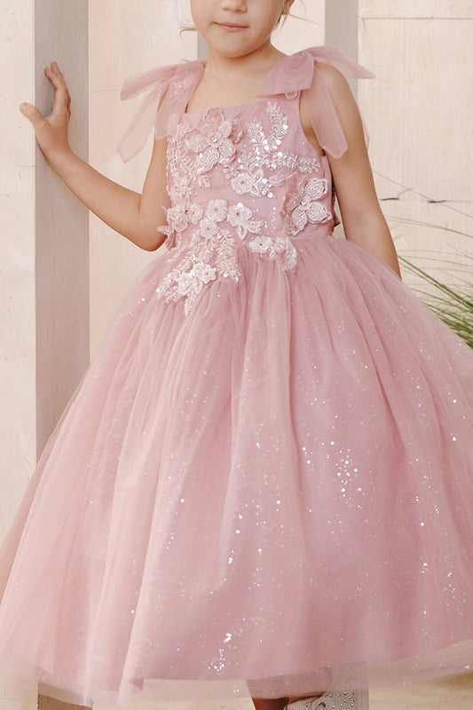 On this dusty rose flower girl dress, 3D bodice flowers are visible.