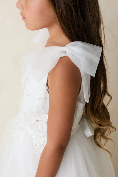 Large shoulder tulle bow on an off-white flower girl dress.