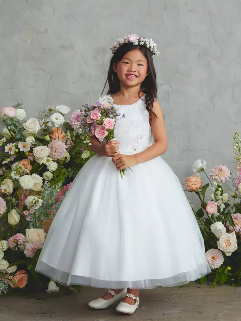 Defined by a full tulle skirt, this off-white flower girl dress.