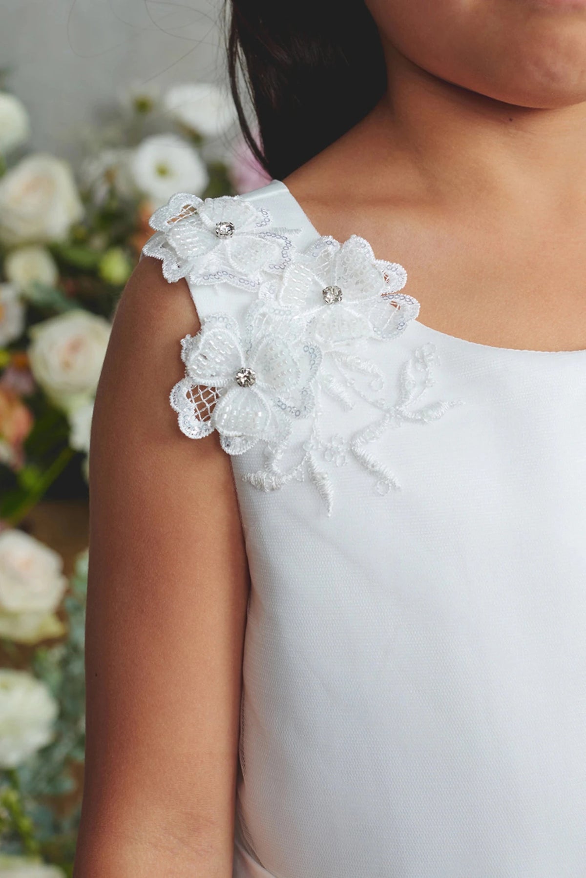 Emphasis on 3D shoulder flowers of the white flower girl dress.