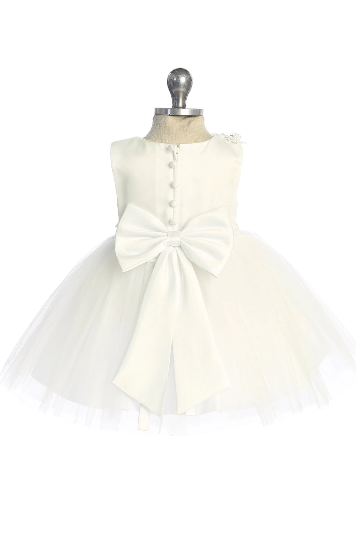 Large satin back bow is visible on the ivory flower girl dress.