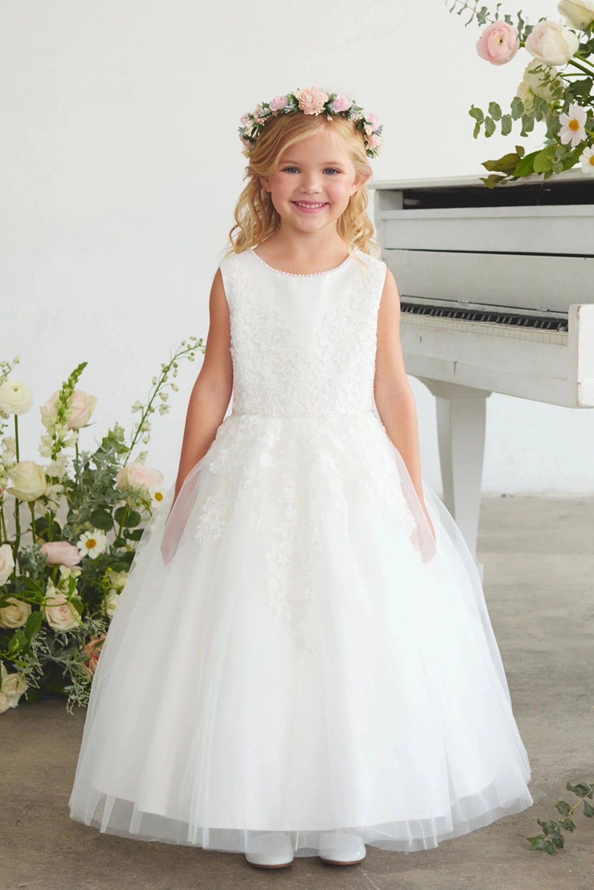 Off-White flower girl dress detailed with a layered tulle skirt.