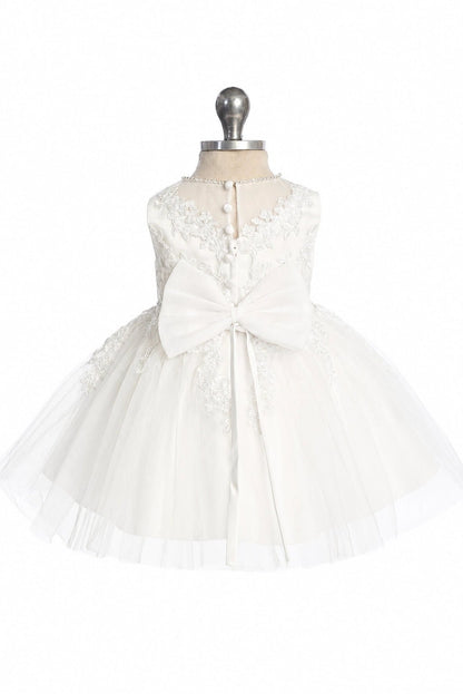 Featuring a narrow rear lace opening, an off-white flower girl dress.