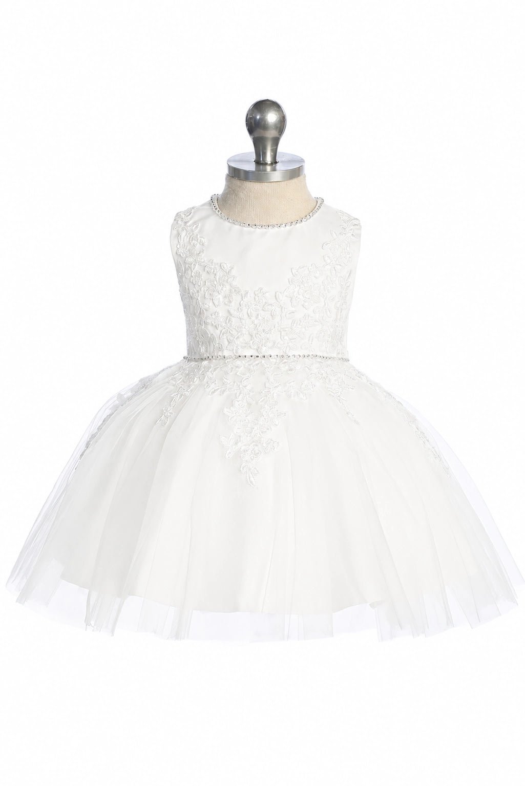 In view: beaded waist trim of an off-white flower girl dress.
