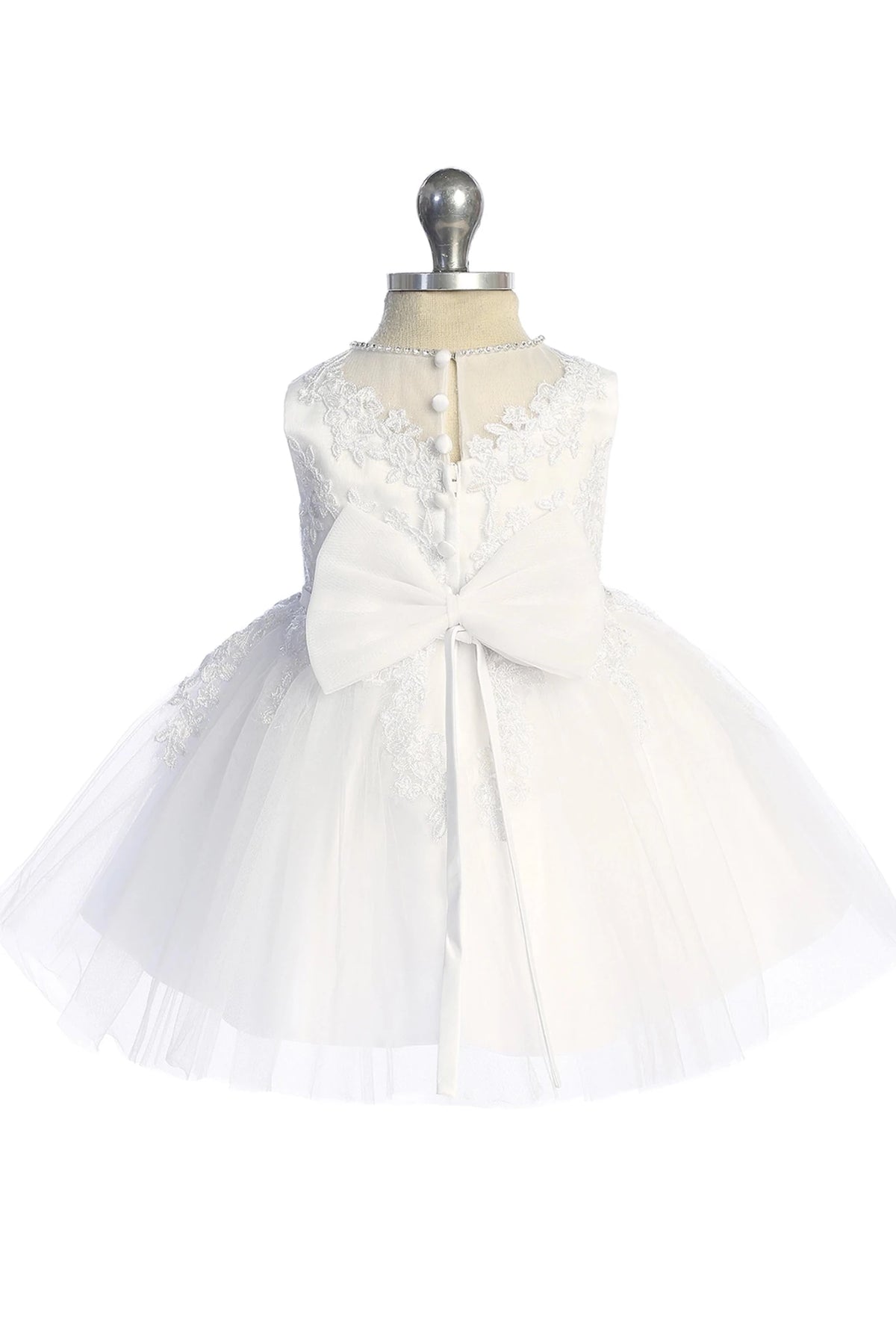 Satin back bow shown on the white flower girl dress.