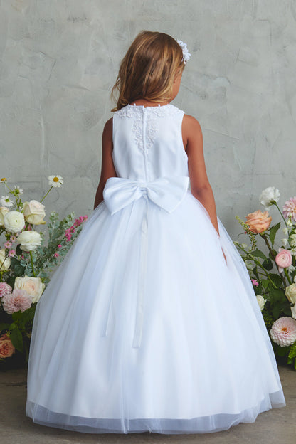 White flower girl dress, showing a large back bow.