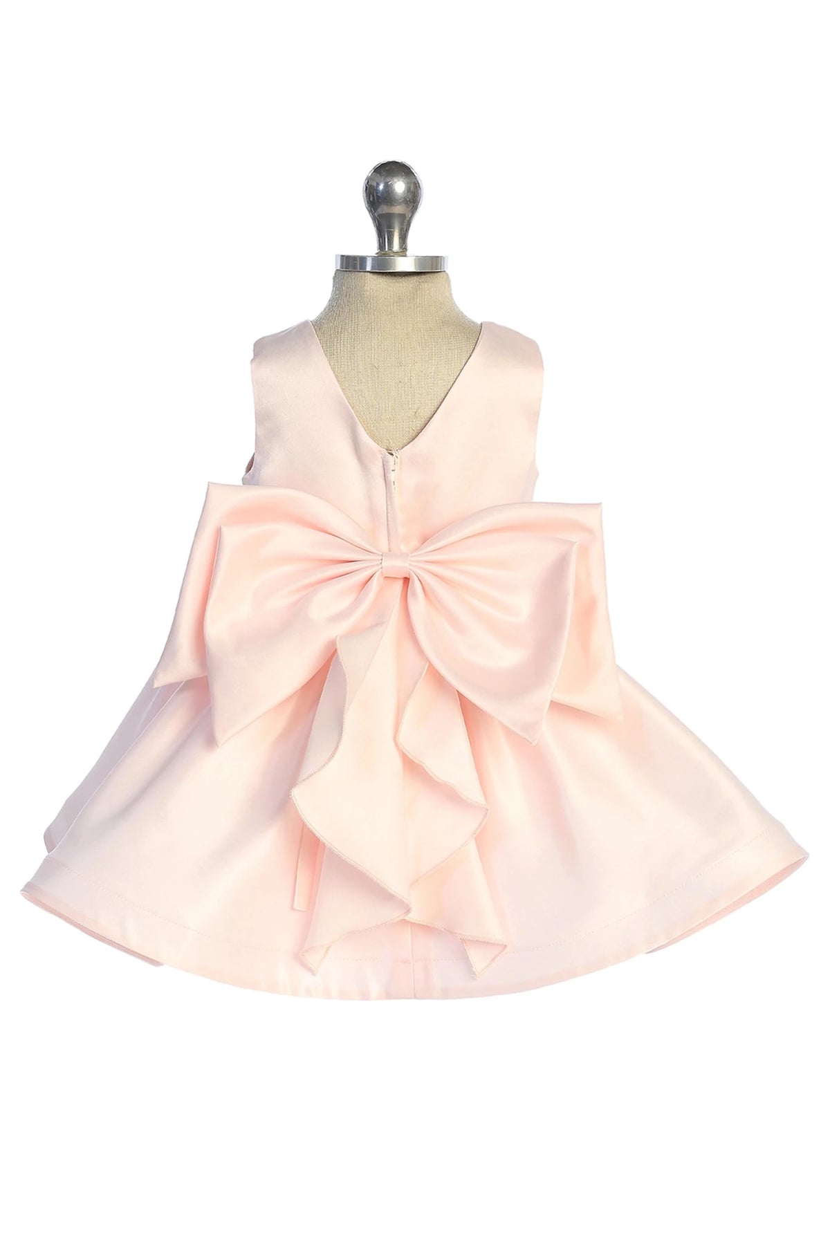 Oversized back bow: detail of the blush flower girl dress.