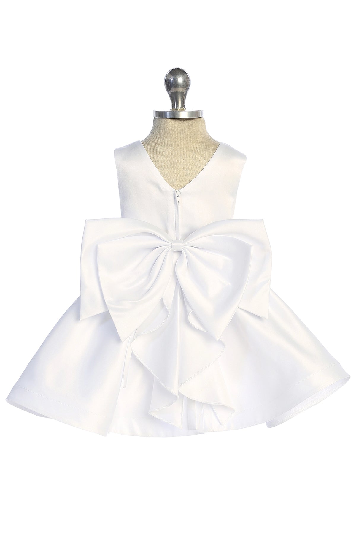 With an oversized satin bow, a white flower girl dress.