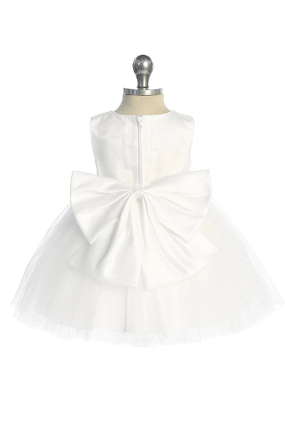 Defined by a large rear bow, this white flower girl dress.