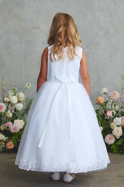The white flower girl dress features a small back ribbon.