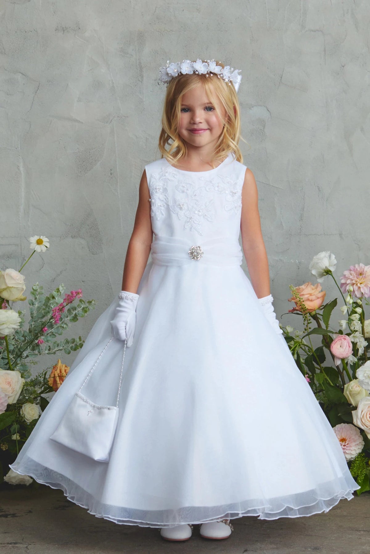 Visible on the white flower girl dress: a jeweled waist brooch.
