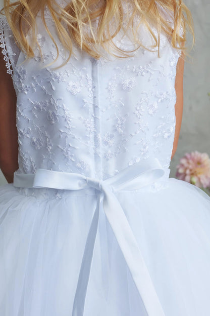 Fine back lace on a white flower girl dress.