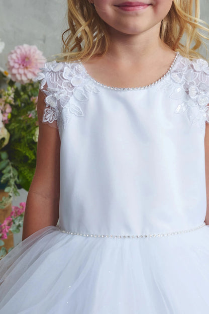 Floral shoulder trim: detail of the white flower girl dress.