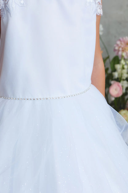 Emphasis on a thin beaded waistband of the white flower girl dress.