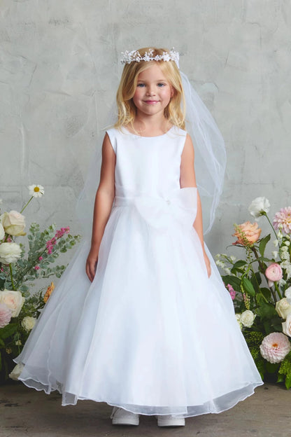 On this white flower girl dress, a full satin skirt is visible.