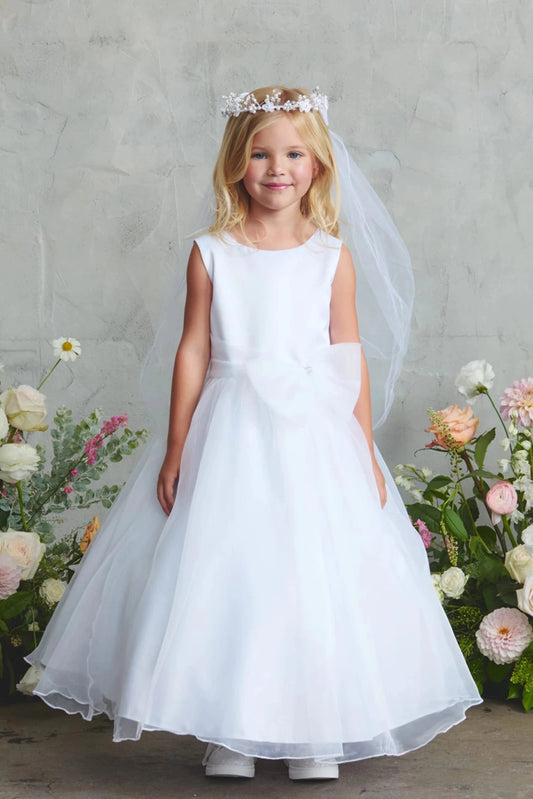 On this white flower girl dress, a full satin skirt is visible.