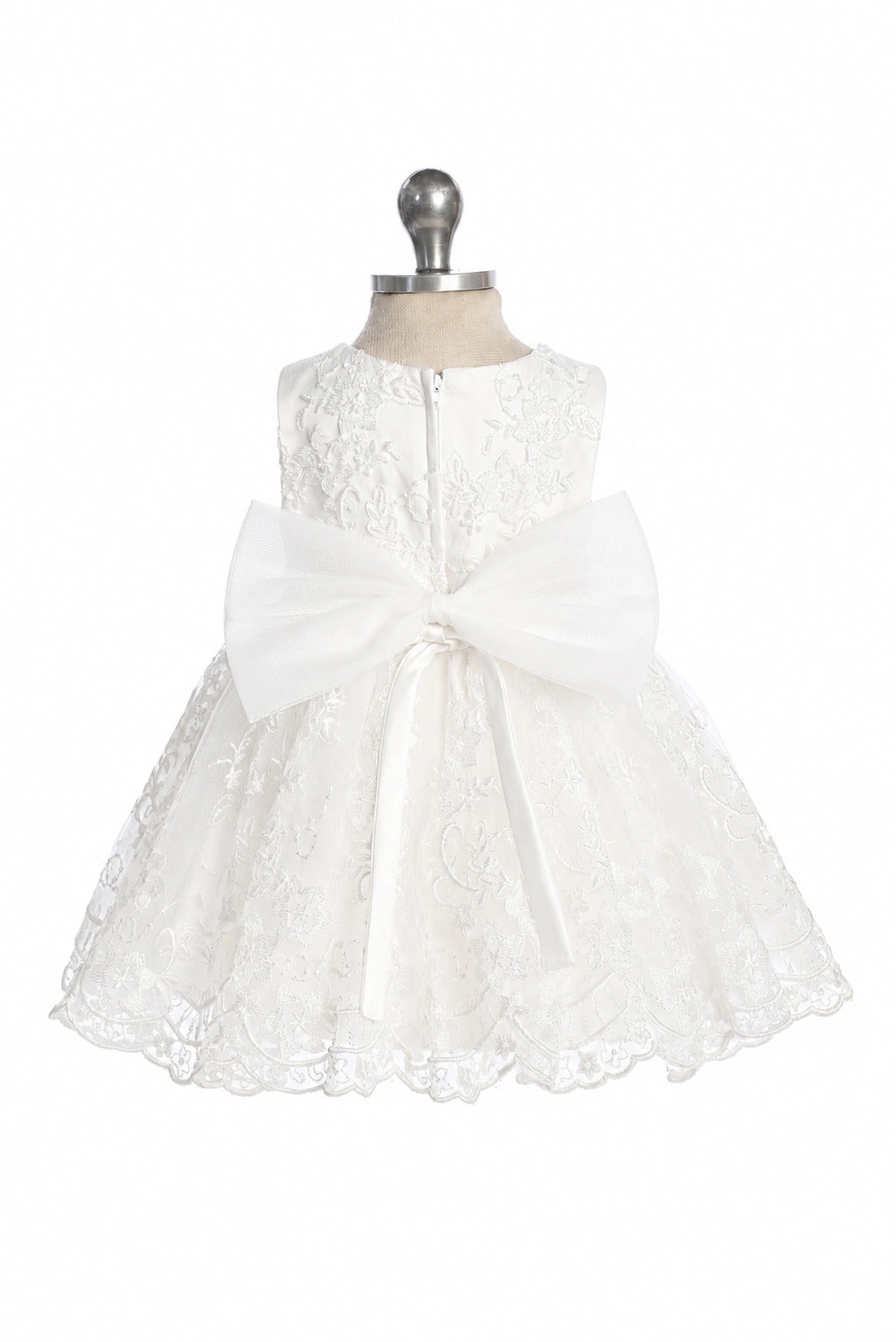 Defined by an oversized back bow, this off-white flower girl dress.