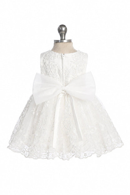 Defined by an oversized back bow, this off-white flower girl dress.