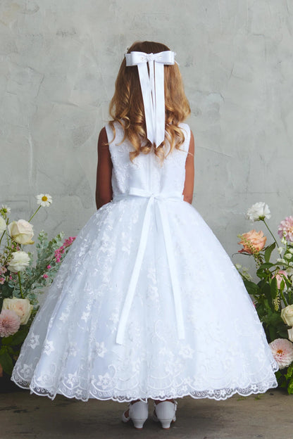 In view: a full lace back skirt of a white flower girl dress.