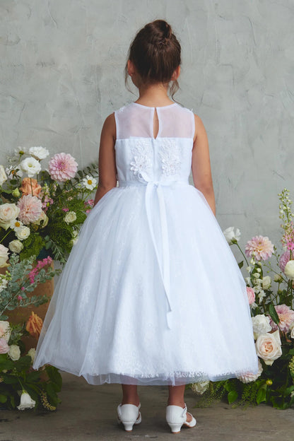 Large satin back bow on a white flower girl dress.