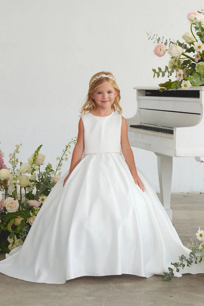 Smooth satin bodice is visible on the white flower girl dress.