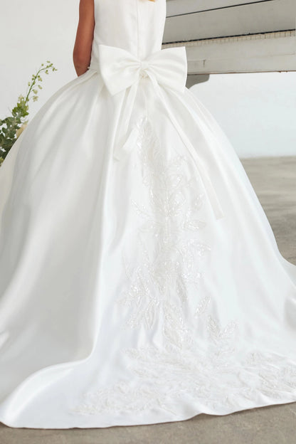Lace-edged back train accents this white flower girl dress.