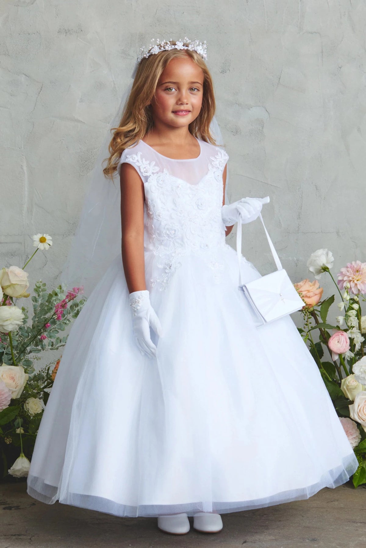 With a full tulle skirt, a white flower girl dress.