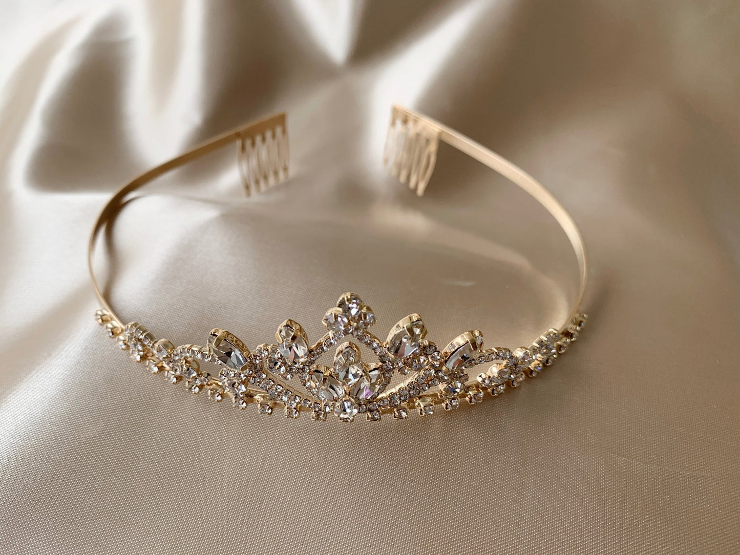 Gold rhinestone flower girl tiara, back view, comb detail.