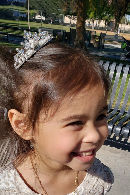 Detailed view highlights aB pearl rhinestone Tiny flower girl and mini quince tiara comb.