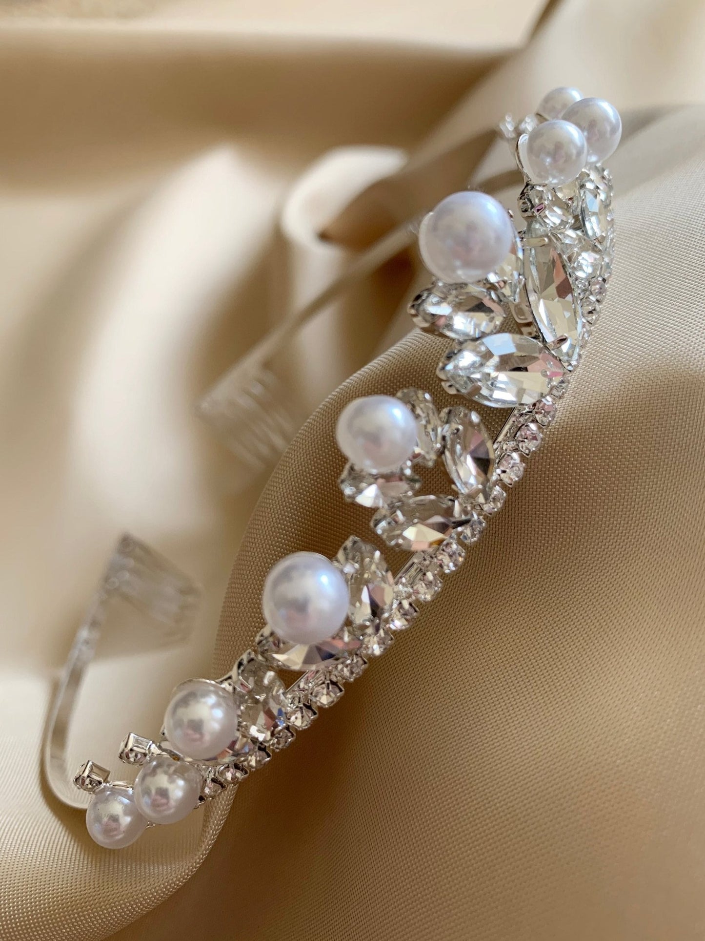 Clear pearl rhinestone flower girl and first communion tiara and two-tier veil, close-up, embellishment detail.