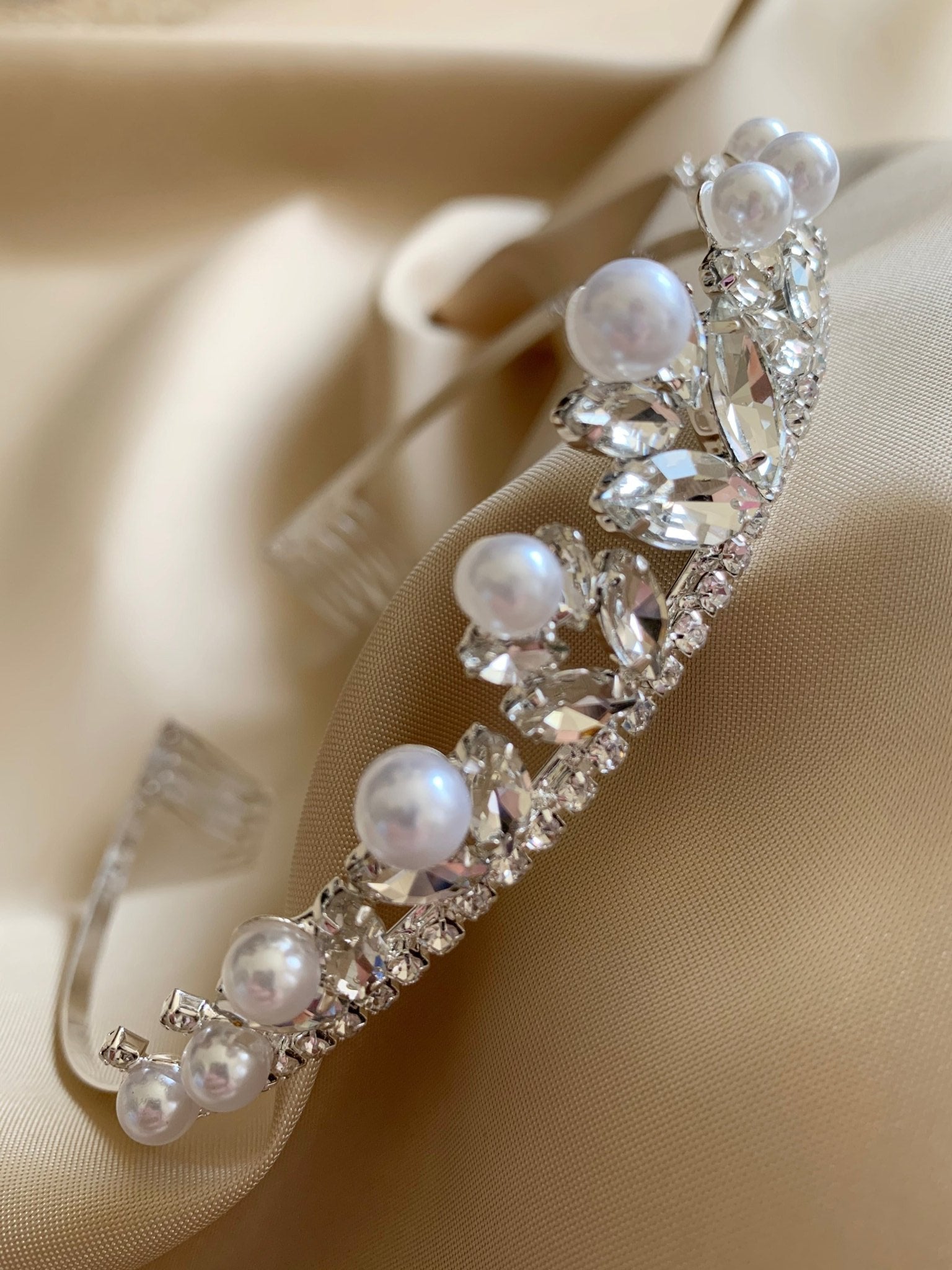 Clear pearl rhinestone flower girl and first communion tiara and two-tier veil, close-up, embellishment detail.