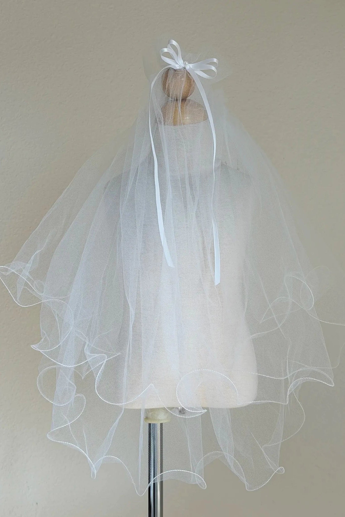 White pearl rhinestone flower girl and first communion tiara and two-tier veil.
