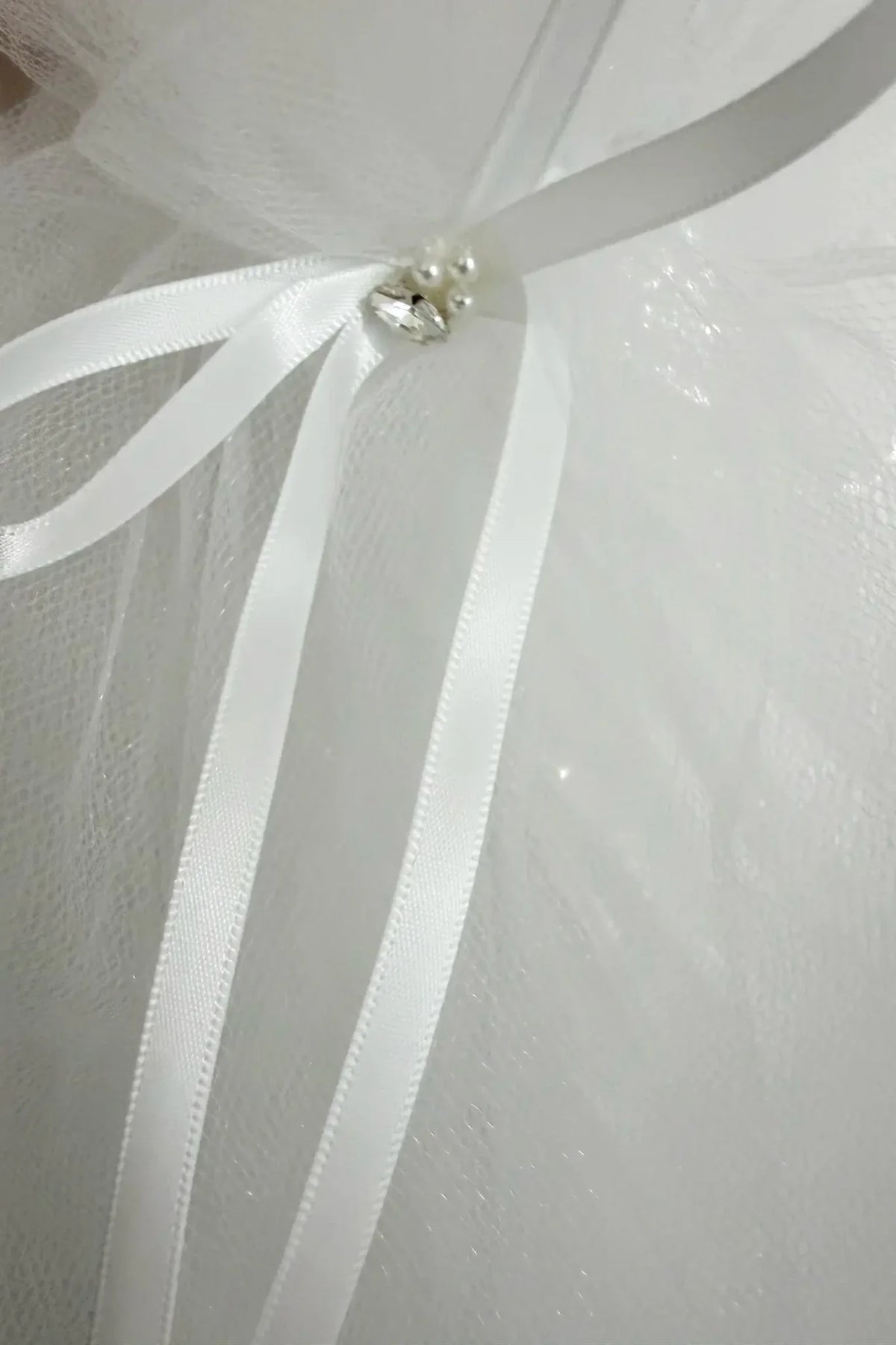 Multi color pearl rhinestone flower girl and first communion tiara and two-tier veil, bow detail.