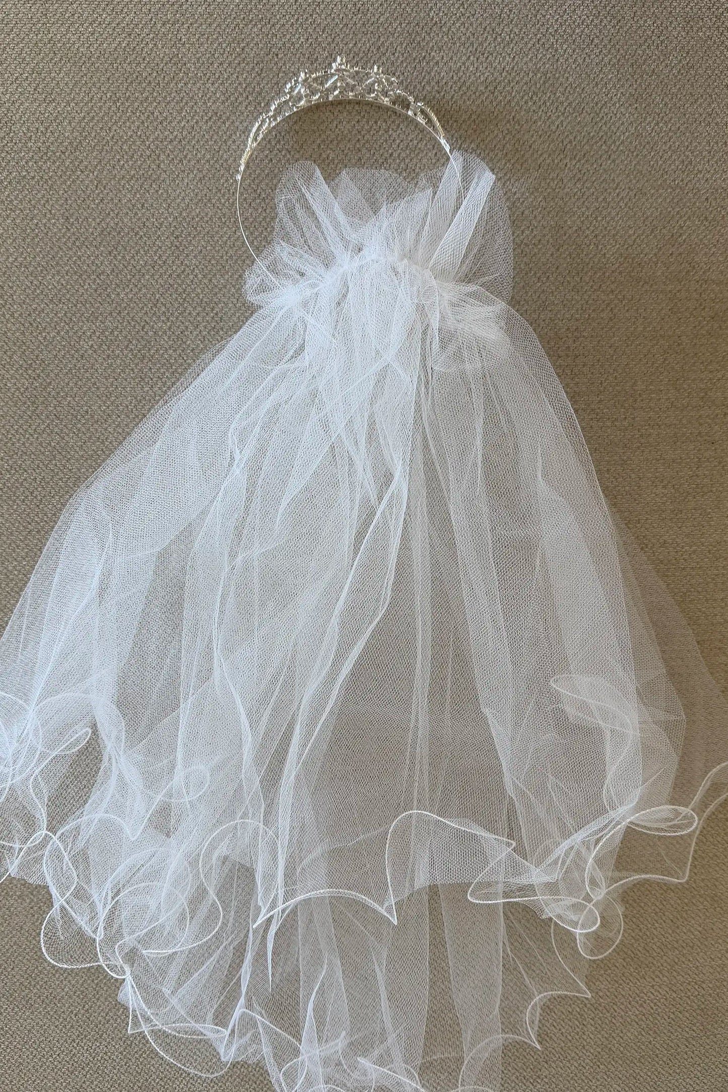 Multi color rhinestone flower girl and first communion tiara and two-tier veil, back view.