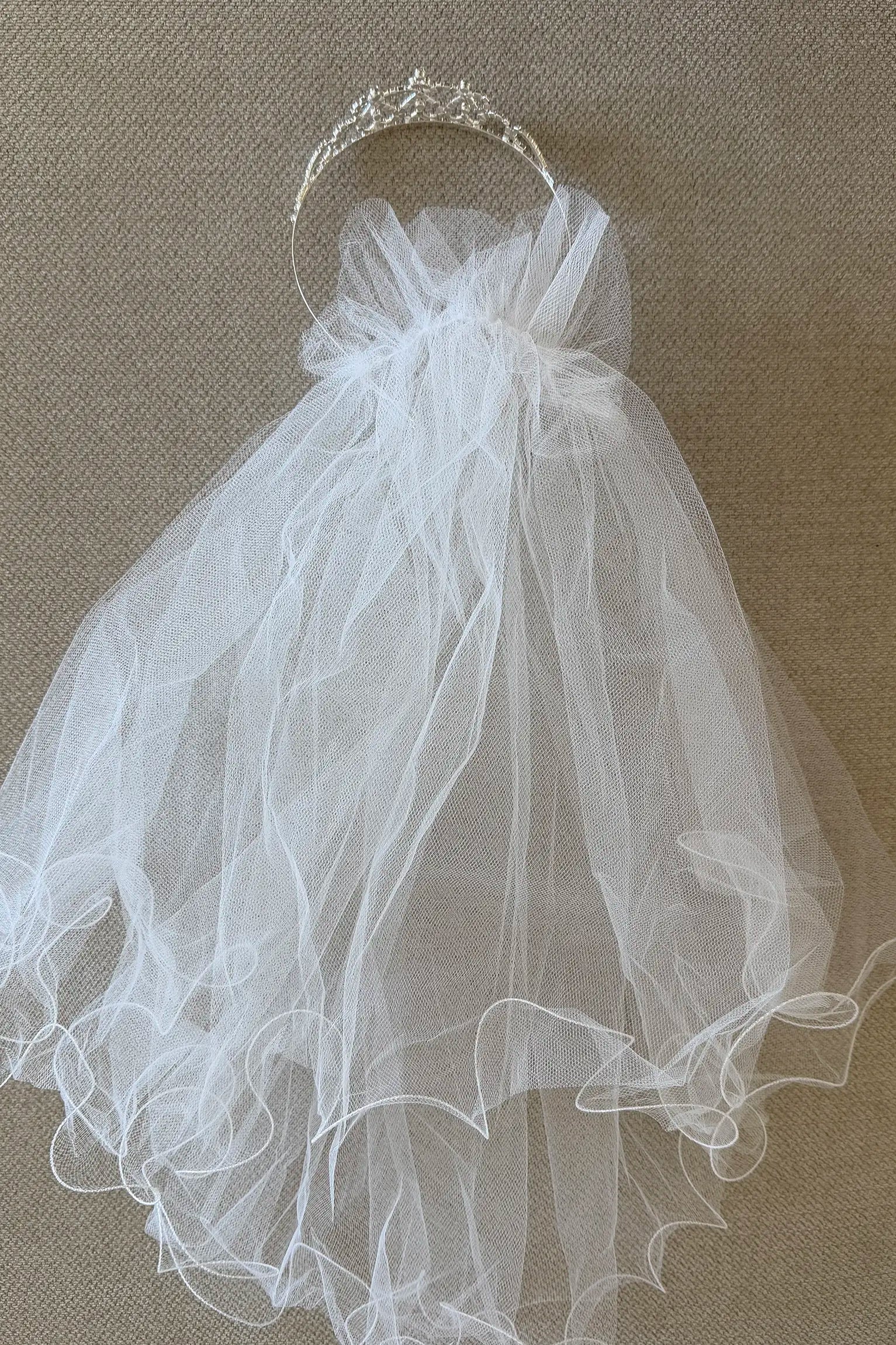 Multi color rhinestone flower girl and first communion tiara and two-tier veil, back view.