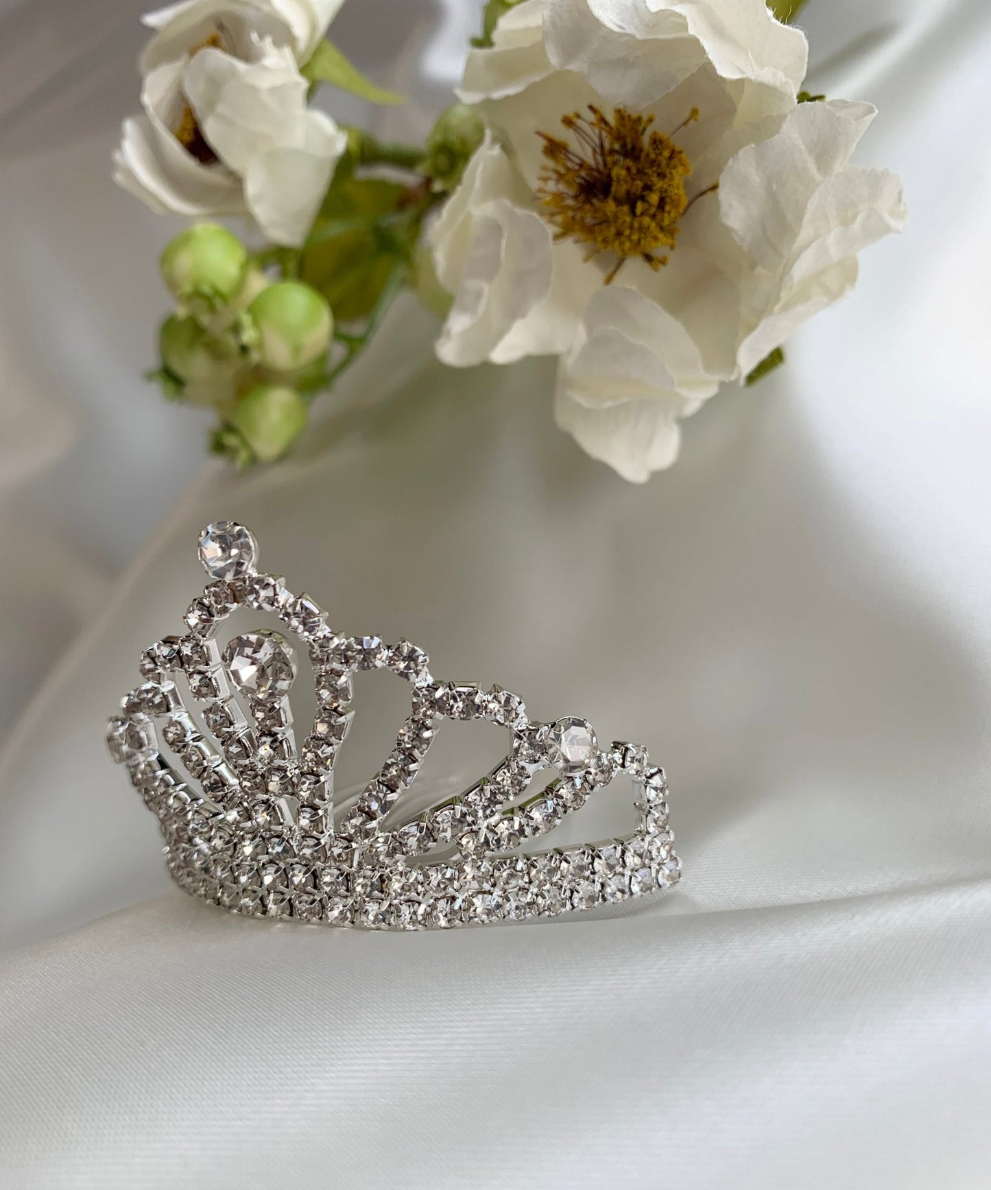 Silver rhinestone floral flower girl tiara comb, side view.
