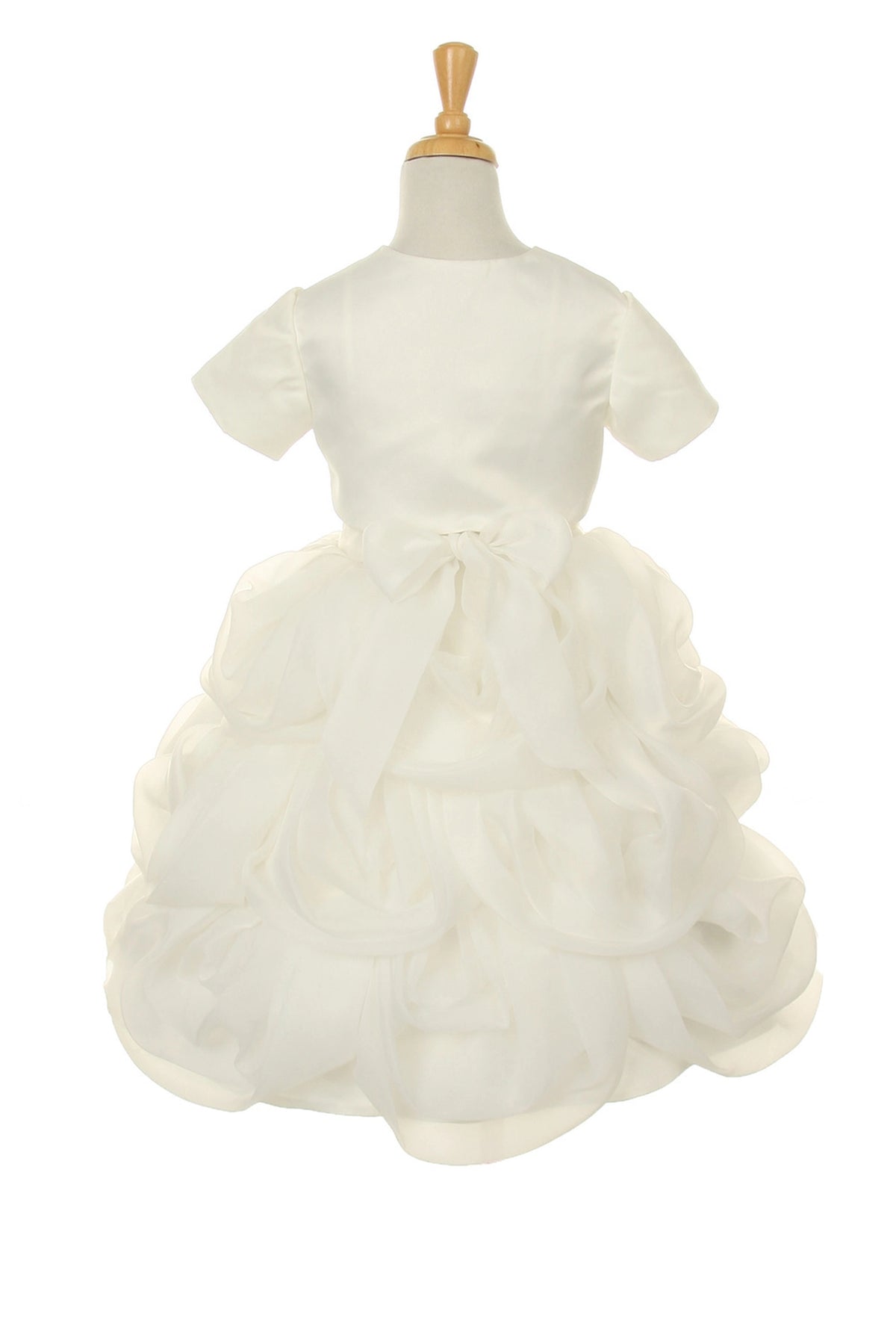 Detailed by large rosettes across the ruffled skirt, the Ivory kids party dress reveals its construction.