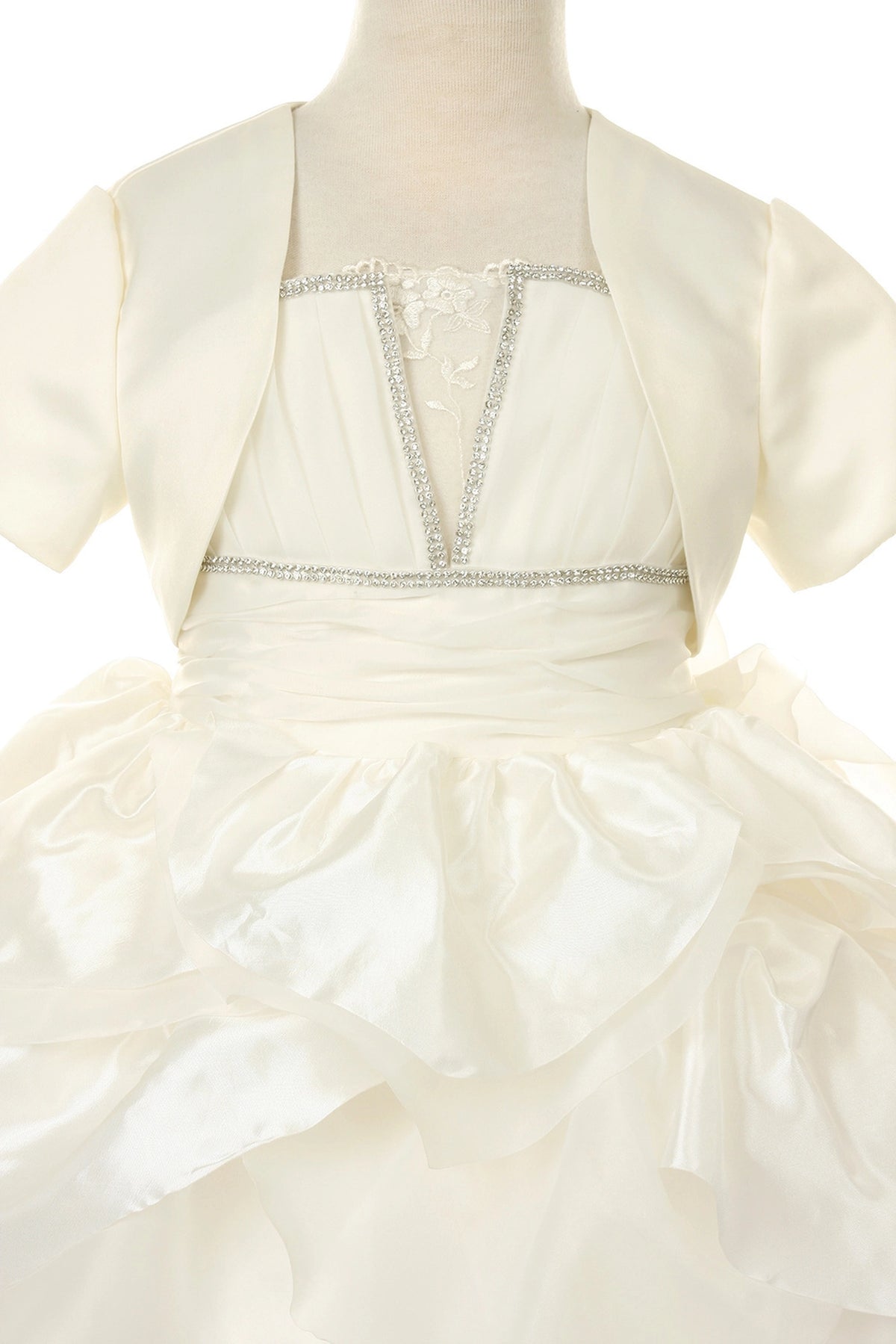 Showcasing with sculpted layered skirt ruffles, this Ivory kids party dress displays elegant detail.