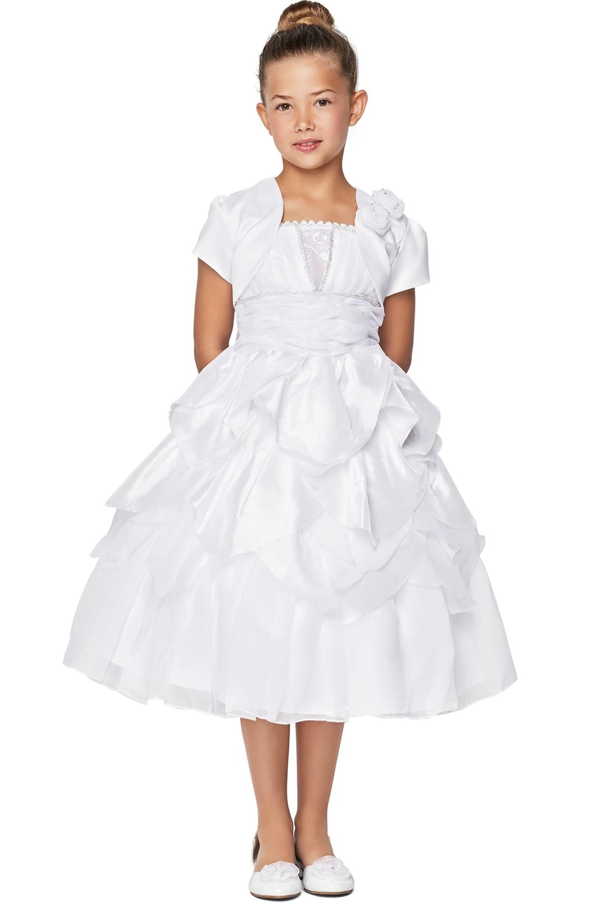 Detailed by a flower-trimmed waist, the White kids party dress reveals its construction.