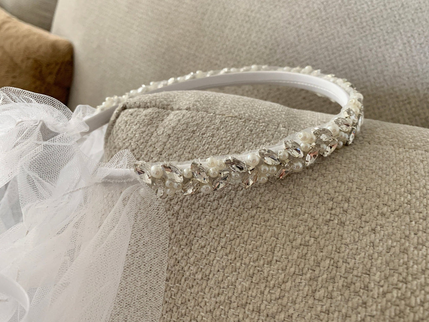 White pearl rhinestone tulle flower girl and first communion headband and two-tier veil.