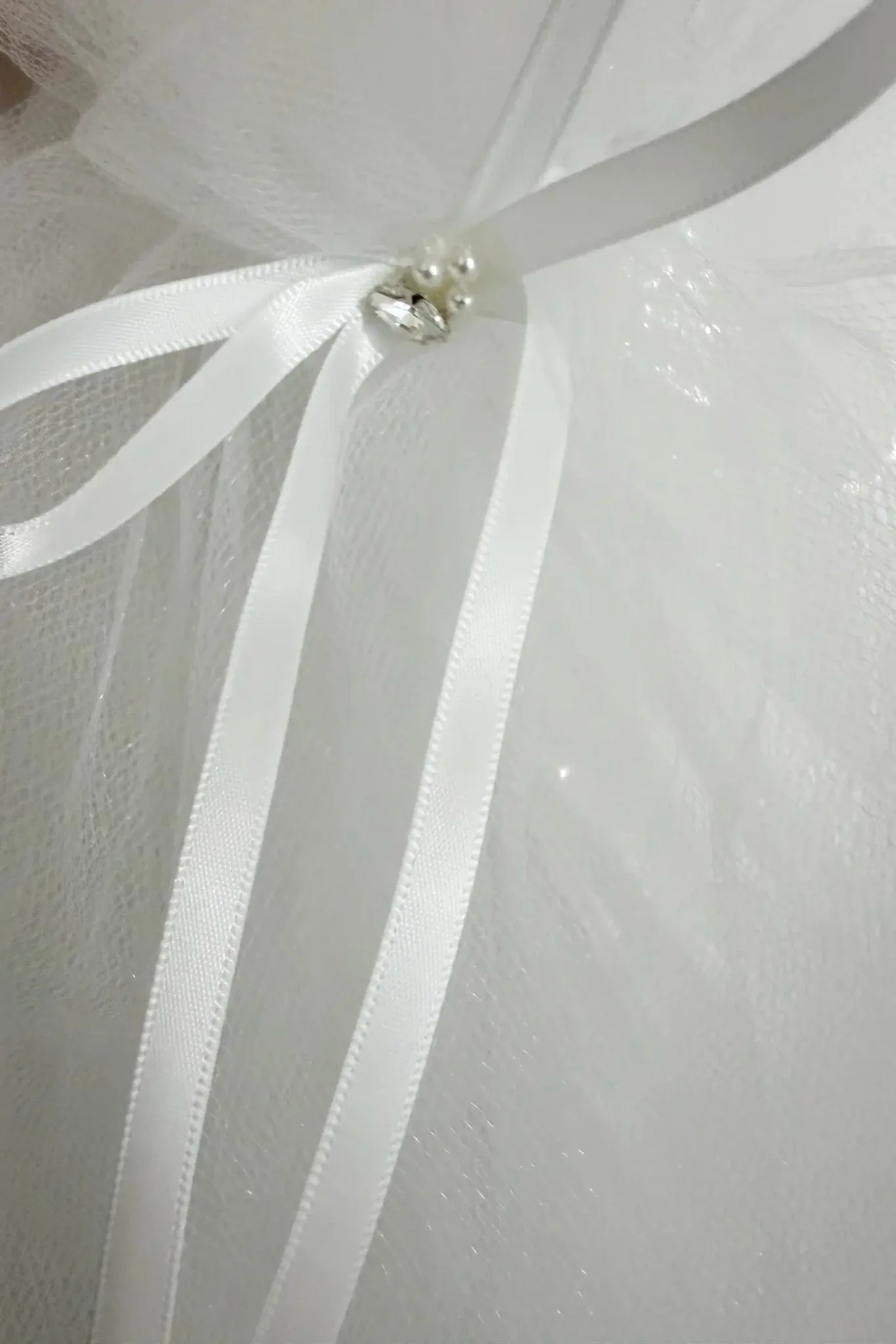 White pearl rhinestone flower girl and first communion headband and two-tier veil, bow detail.
