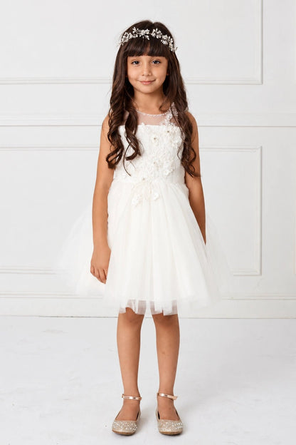 Shown here, an off-white flower girl dress with an asymmetric flower bodice.
