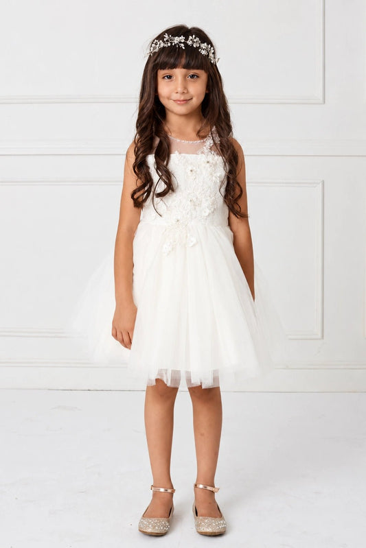 Shown here, an off-white flower girl dress with an asymmetric flower bodice.