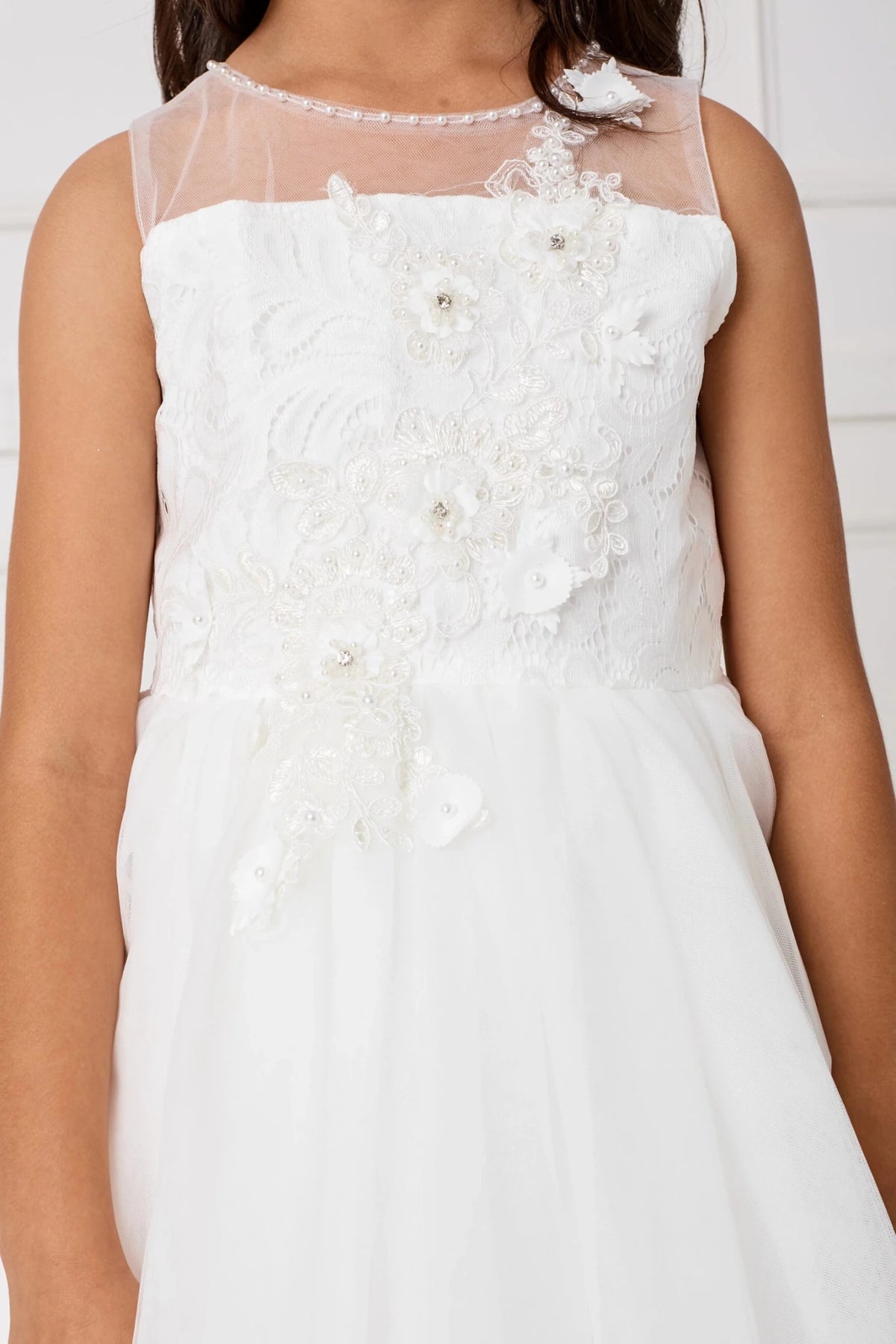 White flower girl dress detailed with beaded waist flowers.