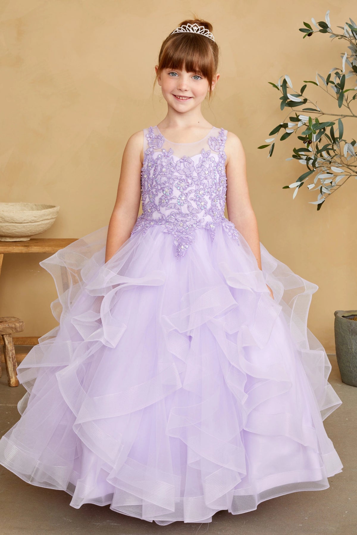 Lilac kids pageant dress featuring a lace bodice and tiered mesh skirt.