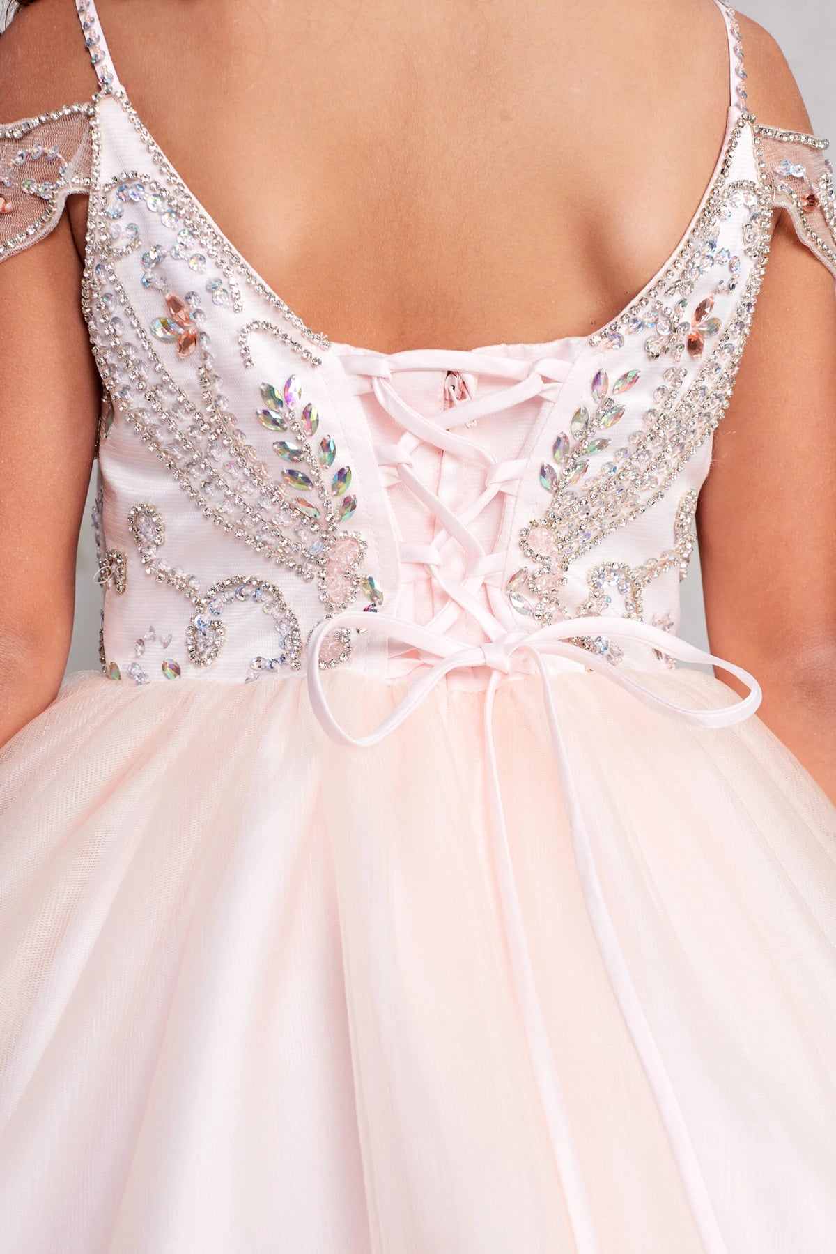 Showing beaded trim at the back neckline, the Blush kids pageant dress has a detailed finish.