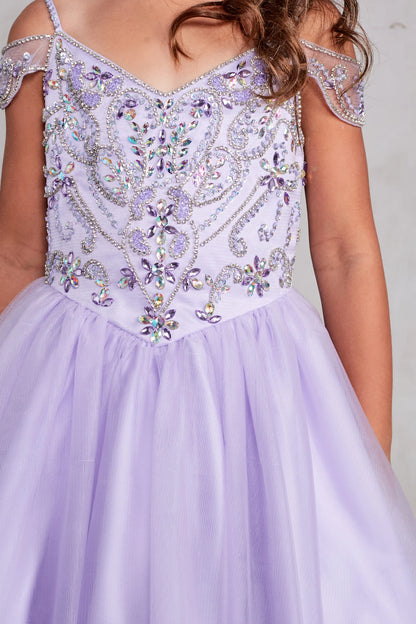 Seen from up close, this Lilac kids pageant dress displays beading around the V-neckline.