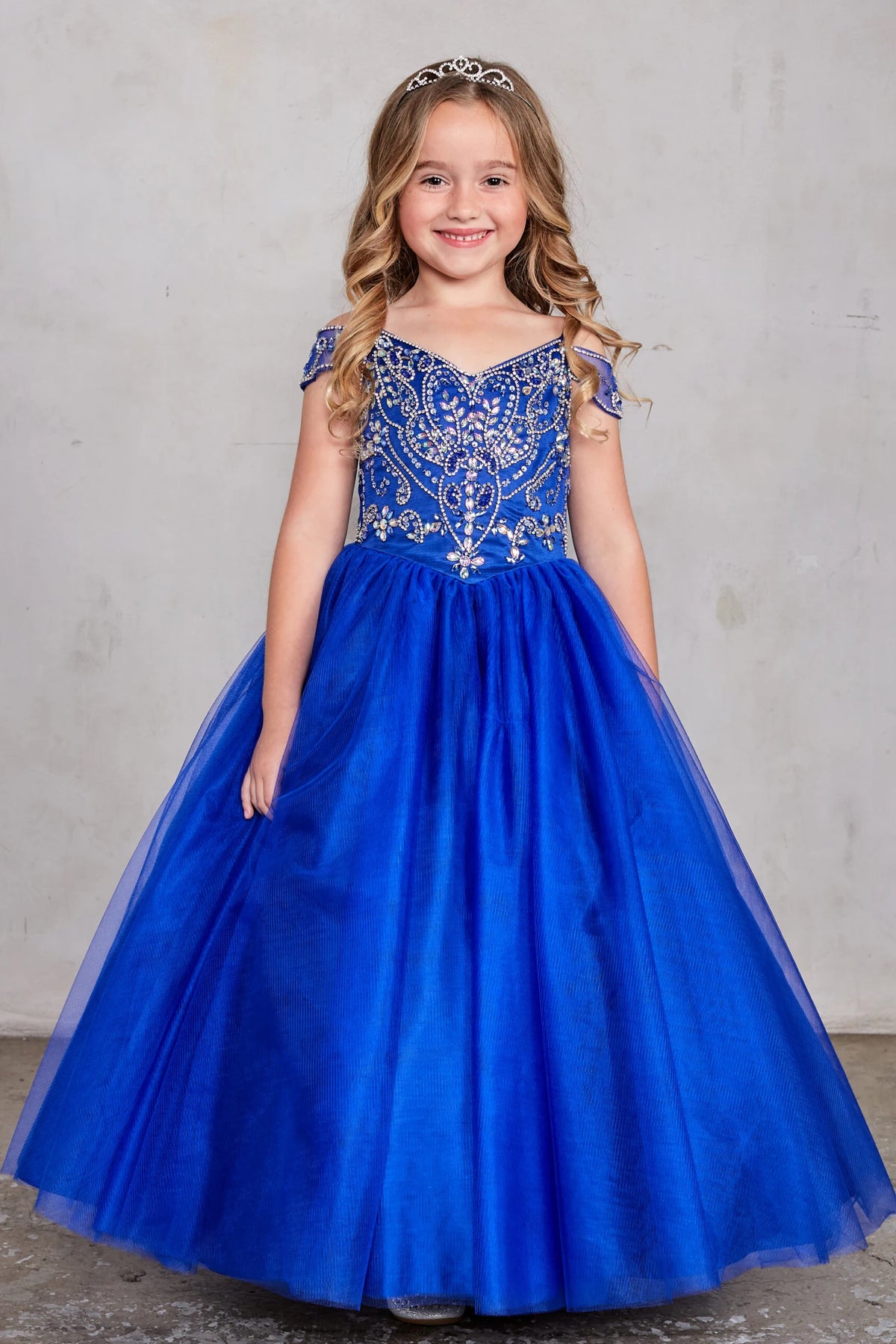 Royal Blue kids pageant dress featuring beaded detailing around a V-neckline.