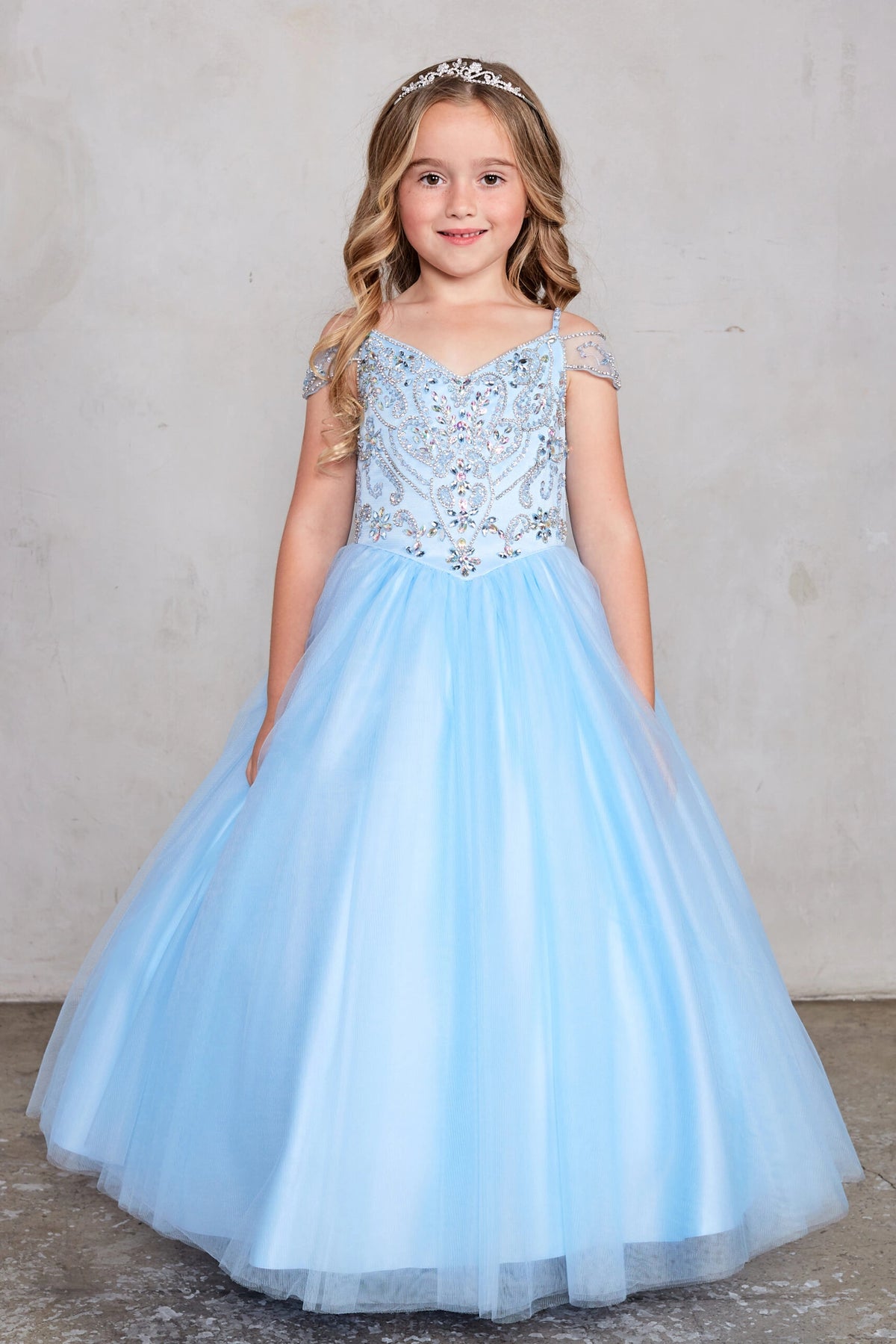 Sky Blue kids pageant dress featuring beaded detailing around a V-neckline.